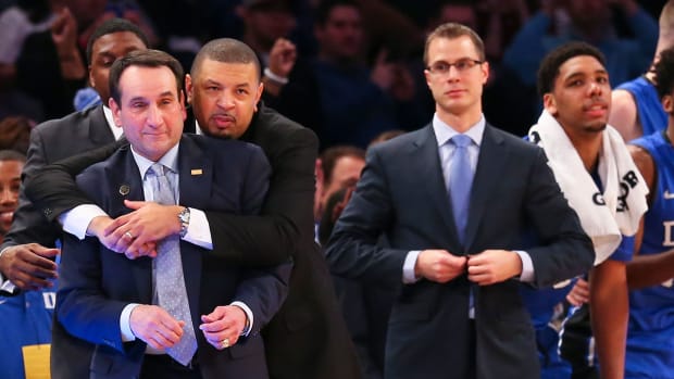 Jeff Capel hugs Coach K after his 1,000th career win