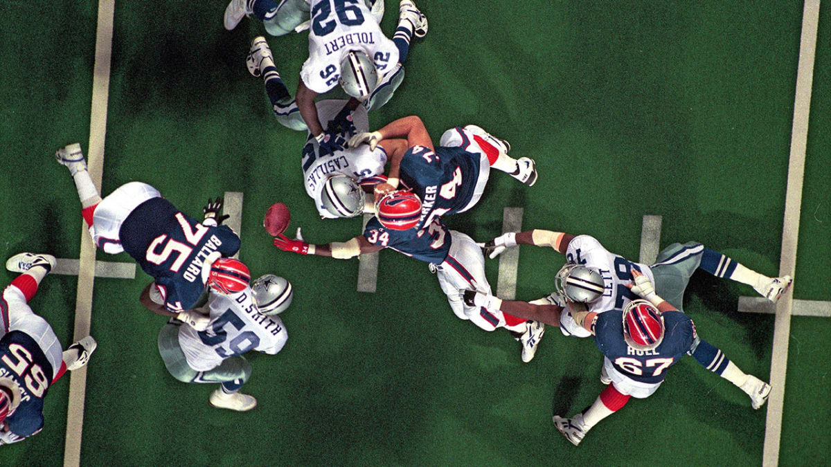 Buffalo Bills running back Thurman Thomas (34) fumbles the ball during the  third quarter of Super Bowl XXVIII against the Dallas Cowboys Jan. 30, 1994  at the Georgia Dome in Atlanta. Coming