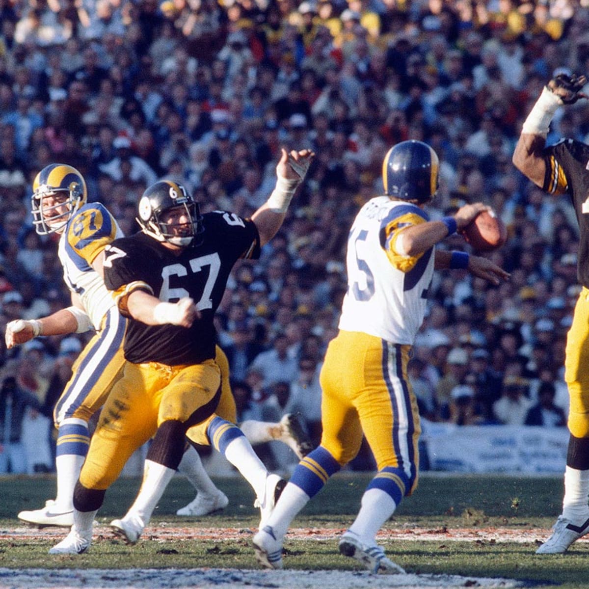 John Stallworth of the Pittsburgh Steelers is tackled by Vernon