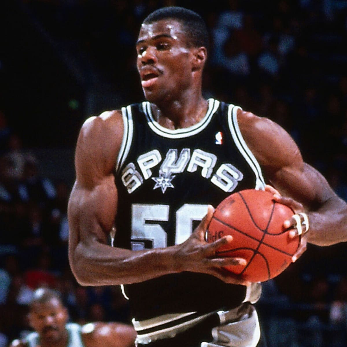 David Robinson of the San Antonio Spurs drives against the