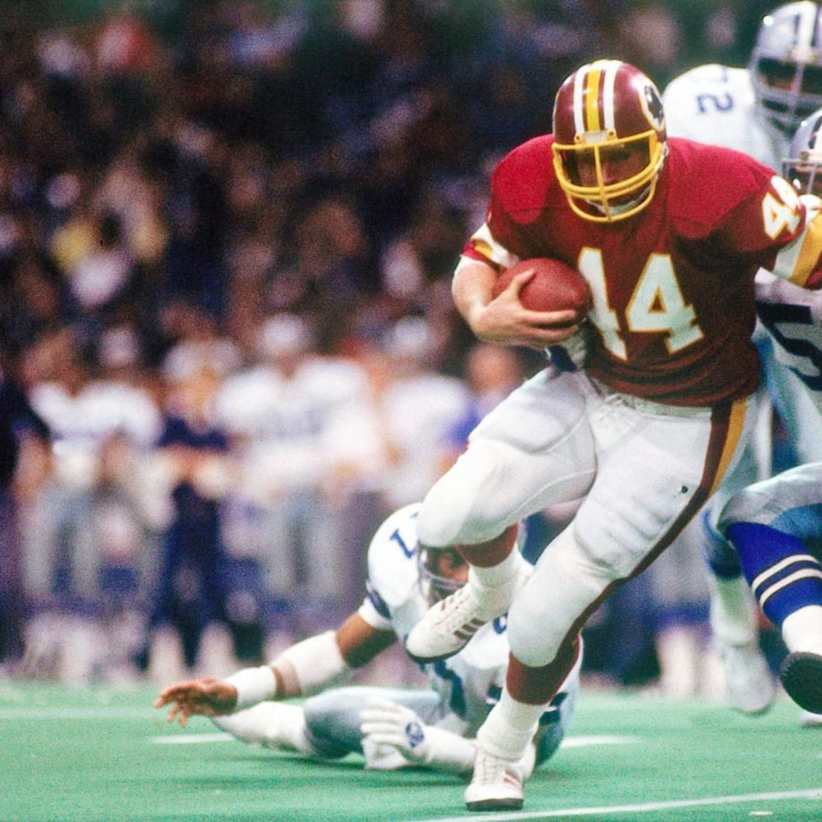 Washington Redskins' John Riggins (44) is pursued by Michael Downs (26) of  the Dallas Cowboys in first half action, Jan. 22, 1983 in Washington. (AP  Photo Stock Photo - Alamy