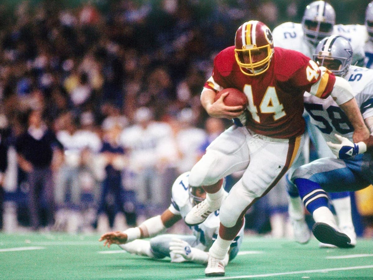 Washington Redskins' John Riggins (44) is pursued by Michael Downs (26) of  the Dallas Cowboys in first half action, Jan. 22, 1983 in Washington. (AP  Photo Stock Photo - Alamy