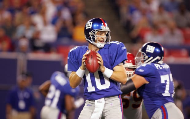 New York Giants quarterback Eli Manning gets face masked in the first  quarter. The New York Giants hosted the New Orleans Saints in week 2 for Monday  Night Football at Giants Stadium