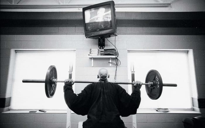 scott-burrell-lifting-weights-behind-closed-doors-vault.jpg