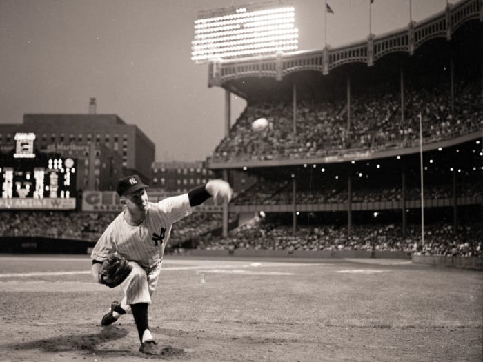 Whitey Ford throwing a pitch