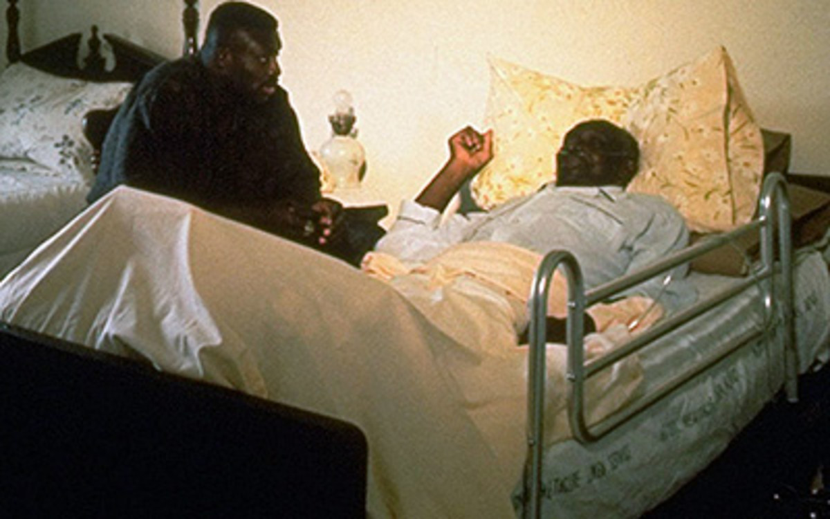 Bruce Smith at the bedside of his father, George.