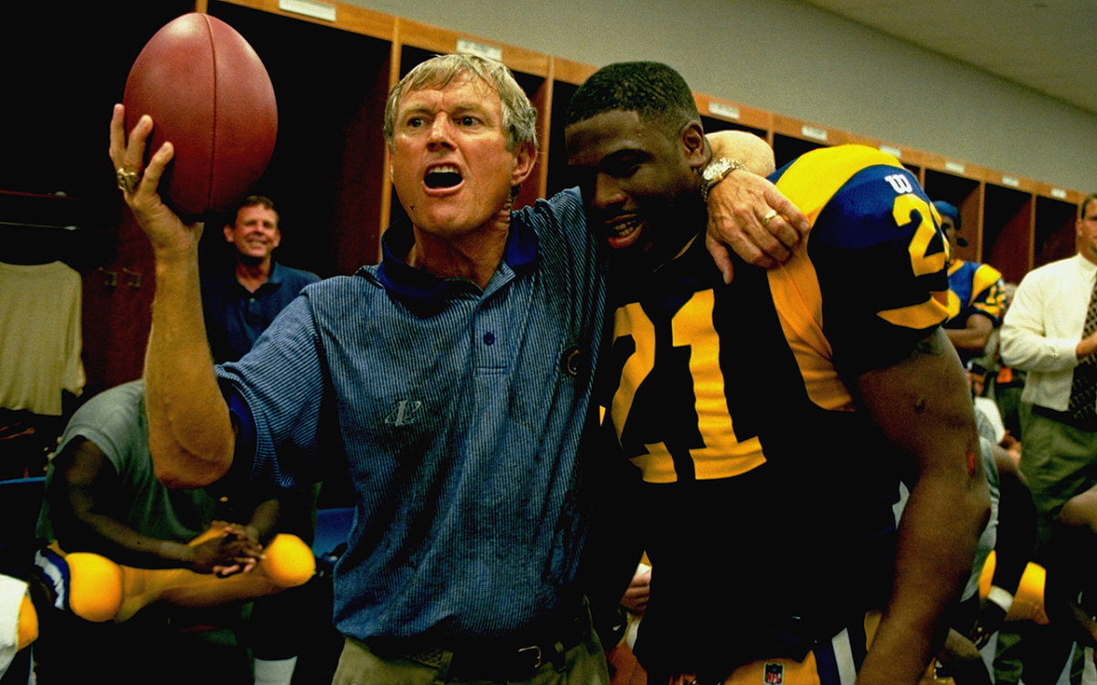 Dick Vermeil hands the game ball to Lawrence Phillips.